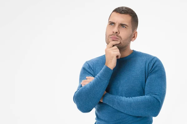 Portrait of handsome young man thinking on something isolated on white background — 스톡 사진