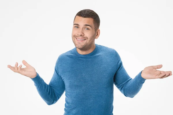 Portrait of young man making clueless gesture having no idea holding hands up isolated on white background — 스톡 사진