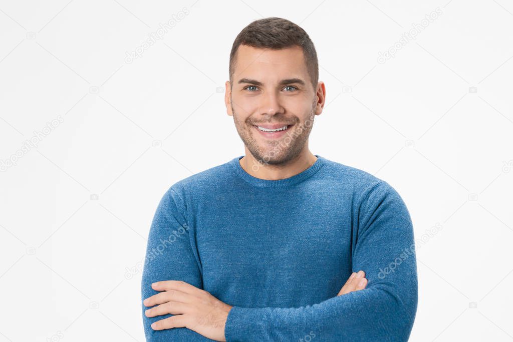 Smiling man with crossed arms over white background