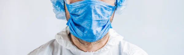Cropped image of doctor wearing protection face mask against coronavirus. Panorama of medical staff