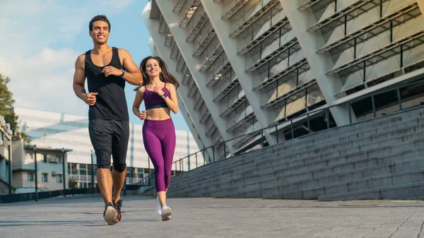 Full Length Young Couple Sport Clothing Running City Street Together Stock Photo