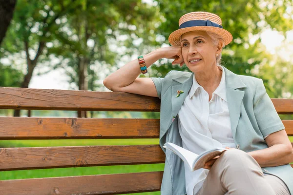 Senior Woman Sitting Public Bench Book — Stock Photo, Image