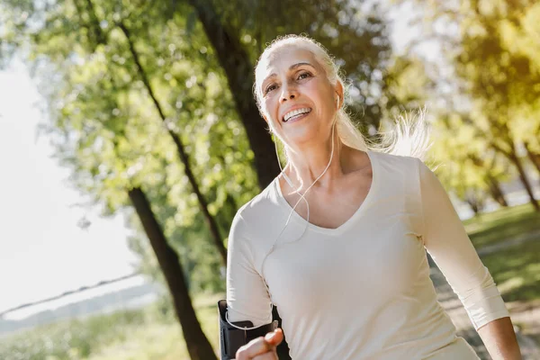 Close up of mature woman exercising in park