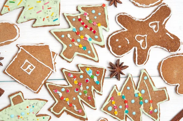 Christmas ginger cookies of different shapes. Xmas trees and men