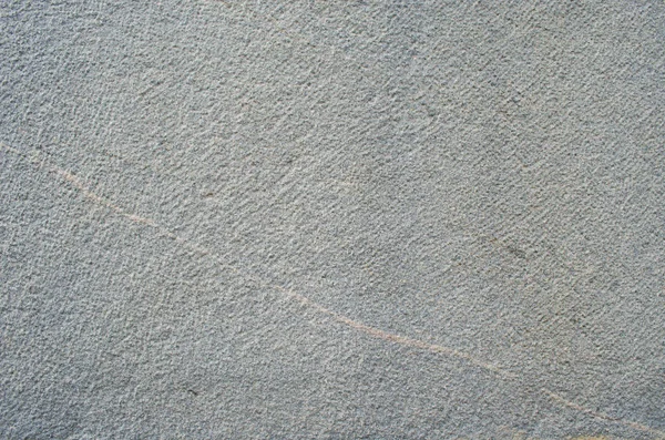 Nervürlü gri duvar.