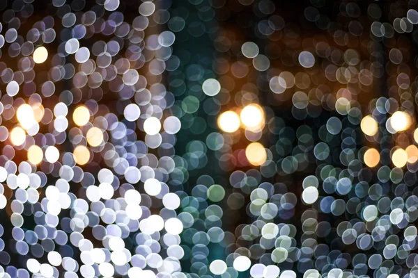 Blurry facade with bokeh garlands. Festive New Year lights