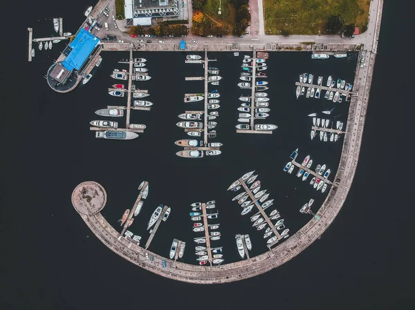 Aerialphoto yacht club with a breakwater. Yachts, motor boats, sailboats, berths, piers. — Stock Photo, Image