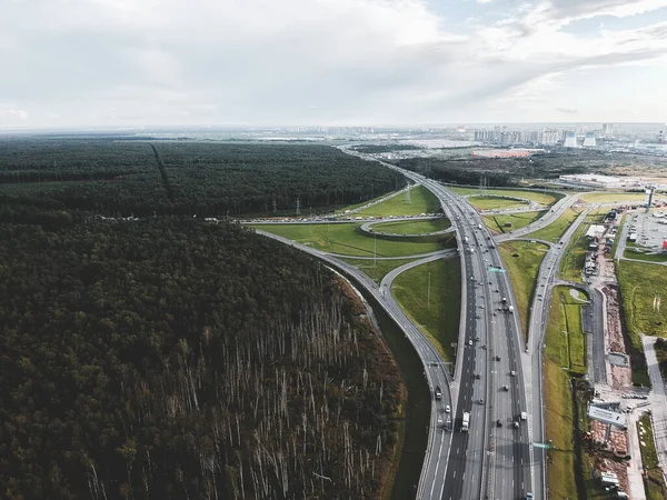 Aerialphoto highway, interchange, car, forest. Saint Petersburg, Russia