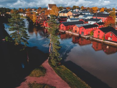 Aerial view of the old red house and barns by the river. Photo taken from a drone. Finland, Porvoo. clipart