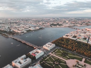Aerial photo of the Neva river in the sunset light. River boats,. Russia, St. Petersburg clipart