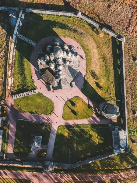 Aerial view of the Old wooden Church Manor Theologian in the autumn forest. Russia, St. Petersburg. — Free Stock Photo