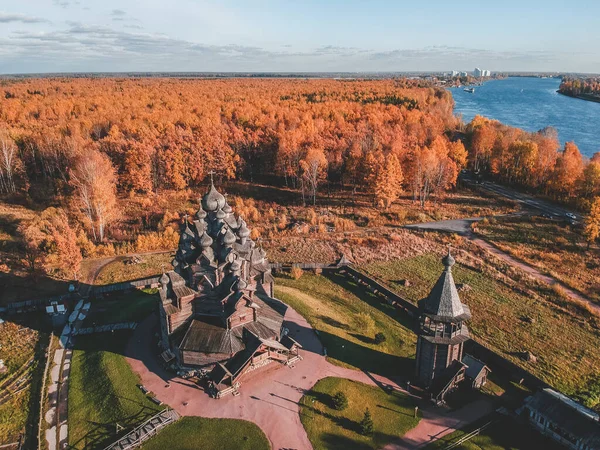 Aerial view of the Old wooden Church Manor Theologian in the autumn forest. Russia, St. Petersburg. — Stockfoto