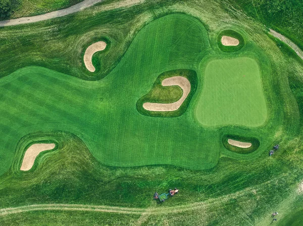 Aerial photo of Golf club, green lawns, tree, road, lawn mowers, Flatley — стокове фото