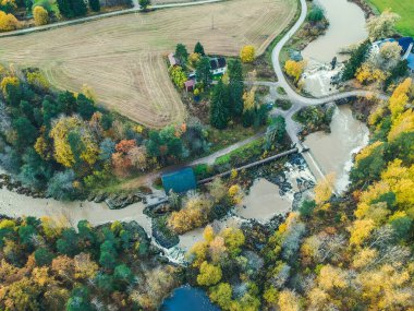 Aerial view of waterfall, river rapids and ancient mill. Photo taken from a drone. Finland, Pornainen. clipart