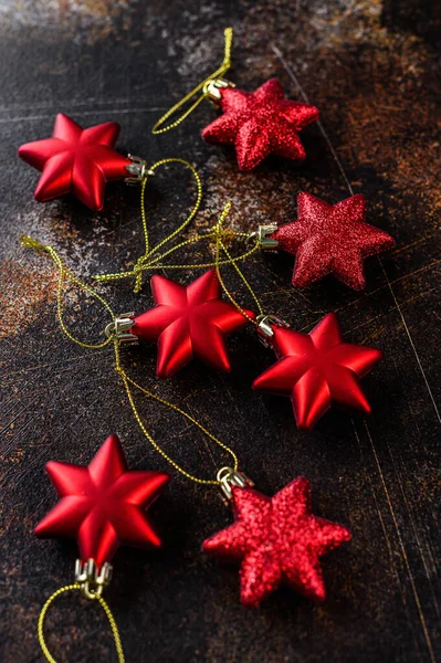 Happy New Year 2020. Christmas background, red stars on dark background. Merry christmas card. Space for text. Happy New Year 2020. selective focus