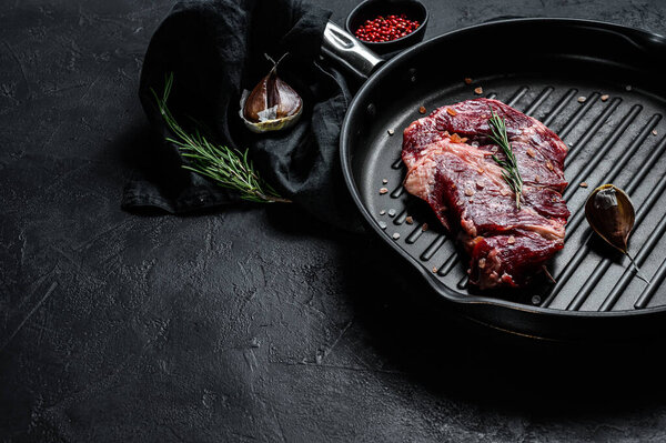 Rib eye steak, fillet of beef. Organic farm meat. Black background. Space for text