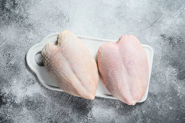 Raw chicken Breasts, fresh fillets with skin. Organic farm bird. Gray background — Stock Photo, Image