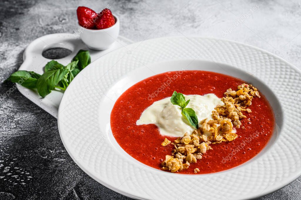 Strawberry puree and Buffalo mozzarella. Gray background. Exquisite Italian dessert