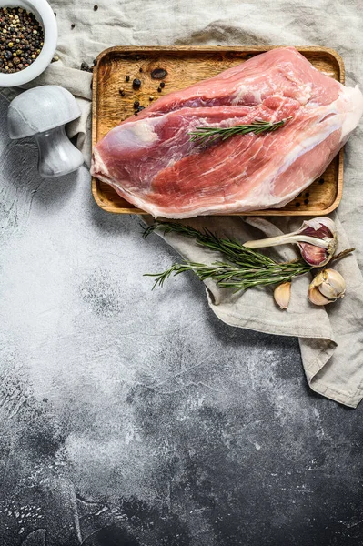 fresh pork cuts. Raw meat with spices. shoulder butt part. Gray background. Top view. Space for text