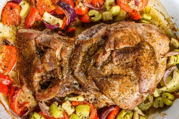 Baked Turkey thigh fillet with vegetables in a baking dish. Gray background. Top view — Stock Photo, Image