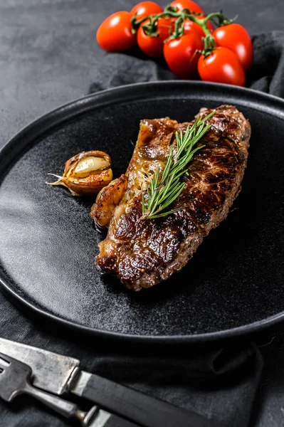Beef strip loin steak on black background. Marble premium beef — Stock Photo, Image