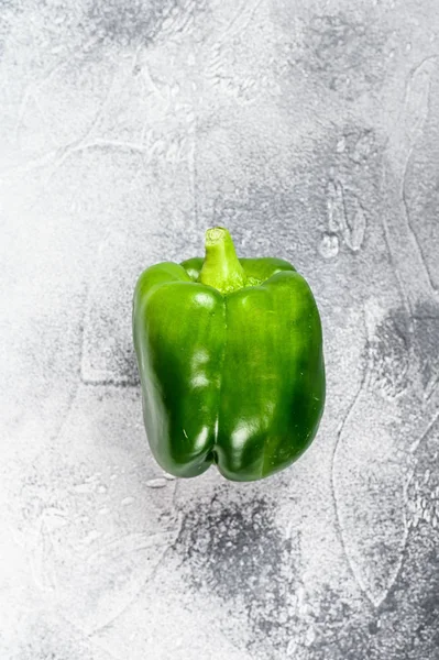 Green bell pepper. Gray background. Top view. Space for text.