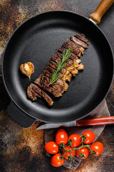 Beef New York strip steak on black background. Space for text. Marble premium beef