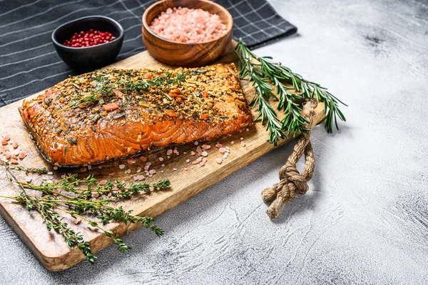 Homemade hot smoked salmon fillet on a cutting Board. trout. Gray background, top view, space for text — 스톡 사진