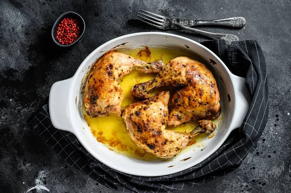 Baked chicken drumsticks with thigh, spices. Black background. Top view — Stock Photo, Image