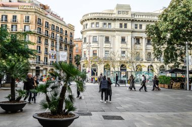 Evening street of the city in the historical center, tourists. 03.01.2020 Barcelona, Spain