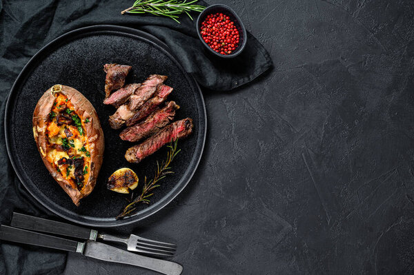 Premium marble beef black Angus. Fried fillet. Organic farm meat. Black background. Space for text.