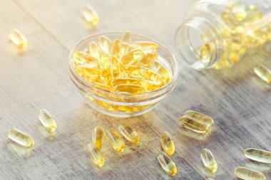 Cod liver oil omega 3 gel capsules clipart