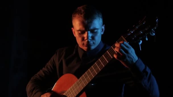 Musician Virtuoso Plays Classical Acoustic Guitar Black Background Close Face — Stock Video