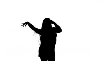 Beyaz arka planda siyah bir siluet, dans eden genç ve güzel bir kadın, oryantal dans. Orta uzunlukta.