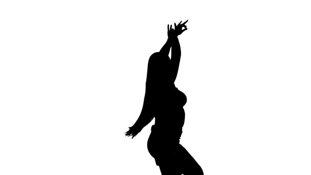 Mittlere Langzeitaufnahme eines jungen schönen Mädchens mit langen Haaren, das Bauchtanz, orientalischen Tanz, exotischen Tanz, schwarze Silhouette auf weißem Hintergrund tanzt