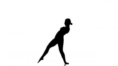 Beyaz arka planda siyah bir siluet, genç ve güzel bir kız dansçı, modern bale dansı, ağır çekim