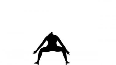 Beyaz arka planda siyah bir siluet, genç ve güzel bir kız dansçı, modern bale dansı, ağır çekim