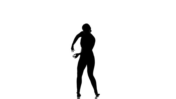 在白色背景上的黑色轮廓 年轻美丽的女舞蹈家跳当代舞 现代芭蕾舞 慢动作 — 图库视频影像