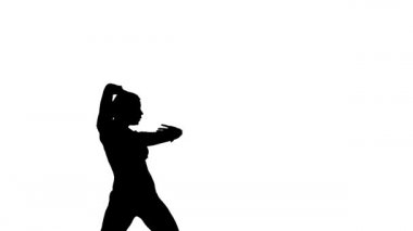 Beyaz arka planda siyah bir siluet, genç ve güzel bir kız dansçı, modern bale dansı, orta boy.