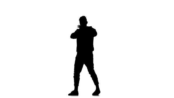 在白色背景上的黑色轮廓 精力充沛的小伙子精力充沛地跳嘻哈 自由式 街头舞蹈 表演着复杂的动作 — 图库视频影像