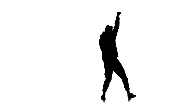 白い背景の黒いシルエット若い元気男がヒップホップ フリースタイル ストリートダンス スローモーションで踊る — ストック動画