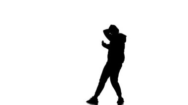 Beyaz arka planda siyah siluet eşofman ve beysbol şapkalı genç kız dansçı hip hop, çağdaş sokak dansı
