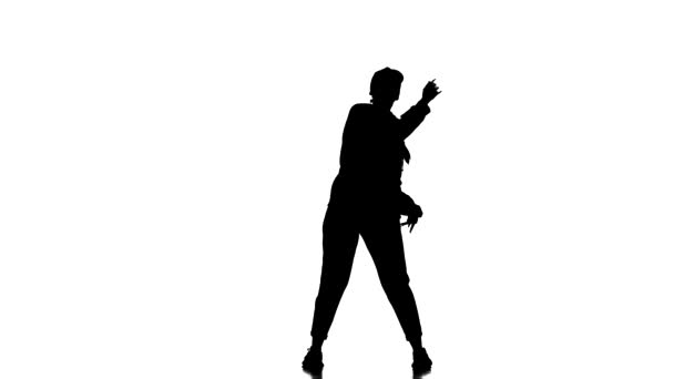 白を基調とした黒のシルエット トラックスーツ姿の若い美少女ダンサーと野球帽ダンスヒップホップ 現代的 現代的なストリートダンス — ストック動画