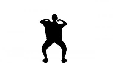 Beyaz arka planda siyah bir siluet, genç ve güzel bir kadın dansçı hip hop, modern sokak dansı, yavaş çekim