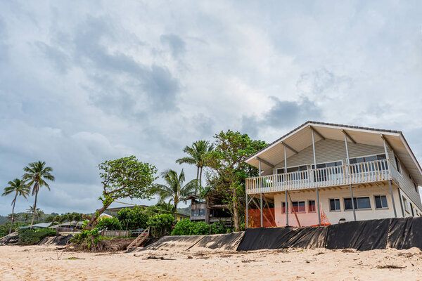 Sunset Beach, Hawaii/USA- Dec. 24, 2019: Loss of yards and homes due to beach erosion on Sunset Beach, Oahu, Hawaii