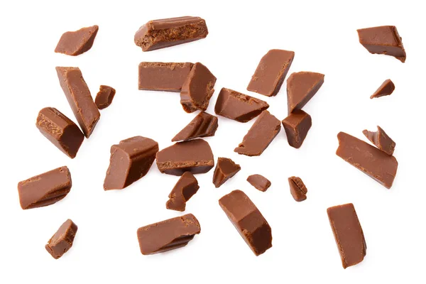 milk chocolate broken into pieces isolated on a white background. top view