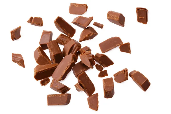 milk chocolate broken into pieces isolated on a white background. top view