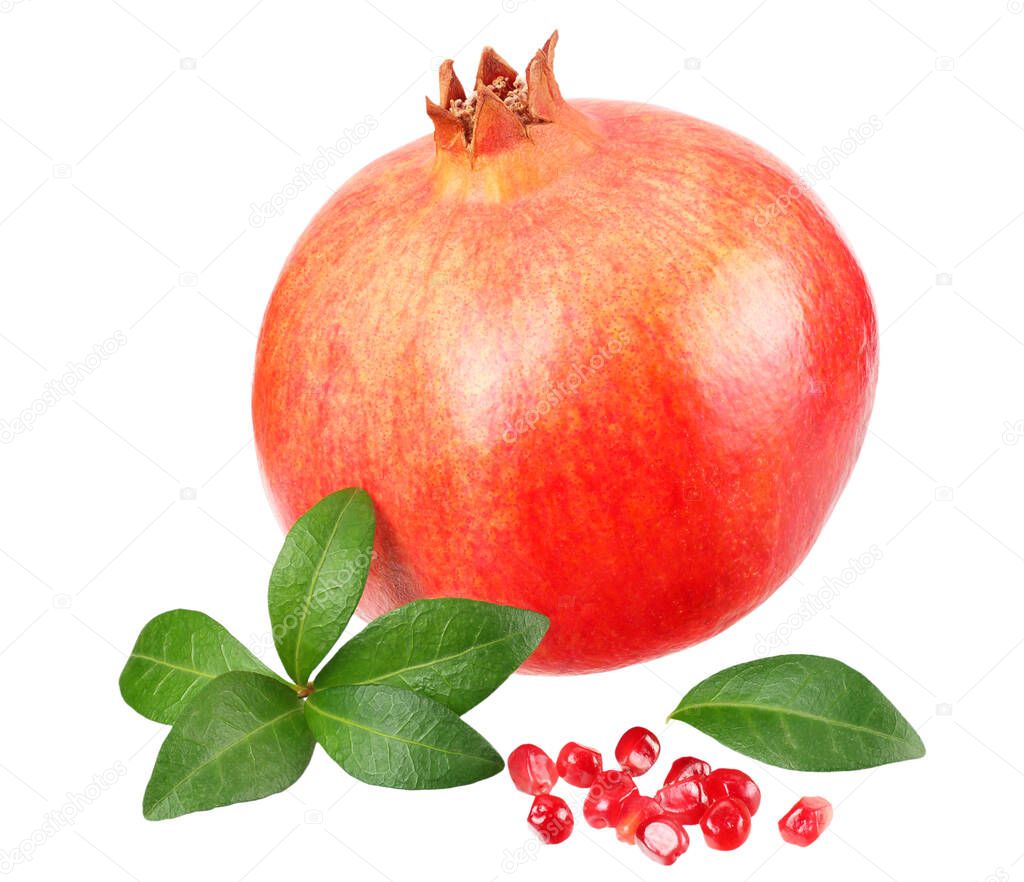 pomegranate fruit with seeds and green leaves isolated on white background
