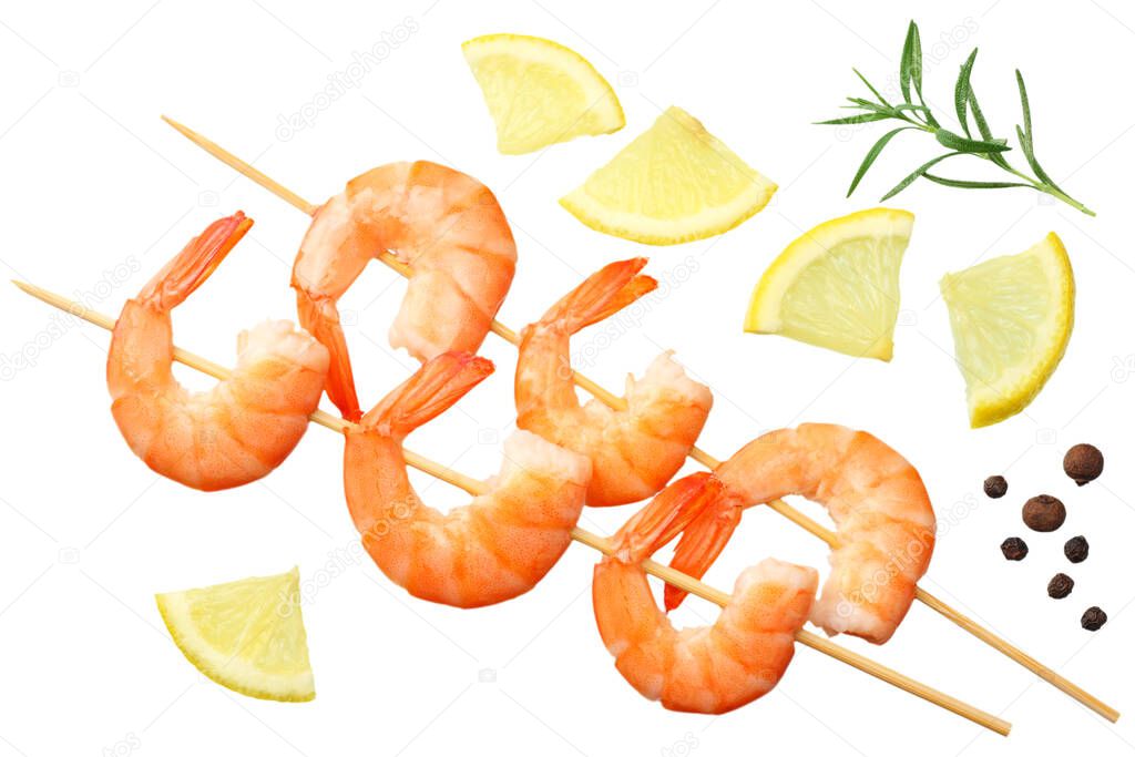 shrimps skewers with lemon and rosemary isolated on a white background. top view