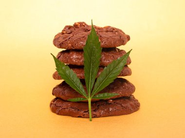 Medicinal Edibles Cookies with Marijuana. cannabis leaf and chocolate chip cookies . food with recreational drug clipart